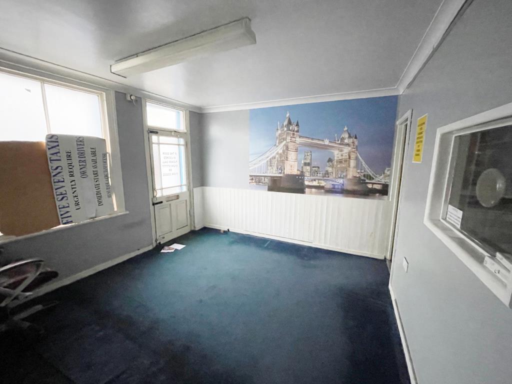 Lot: 64 - A MIX OF COMMERCIAL AND RESIDENTIAL PROPERTY FOR IMPROVEMENT IN CITY CENTRE - Front waiting room of the old taxi office